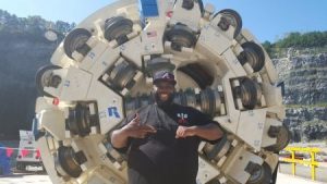 Rap star Killer Mike with the tunnel-boring machine named in his honor.