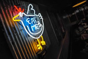 Gus's Fried Chicken Eat Me sign (Becky Stein Photography) Mall at Peachtree Center, on Friday October 16, 2015. Neon 'eat me' sign (Becky Stein Photography)