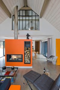 Mid Century Home with Modern fireplace painted orange HausZwei Homes Kevin Polite Solid Source Realty, Inc.