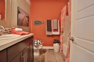 Mid Century Home with Modern wall painted orange HausZwei Homes Kevin Polite Solid Source Realty, Inc.