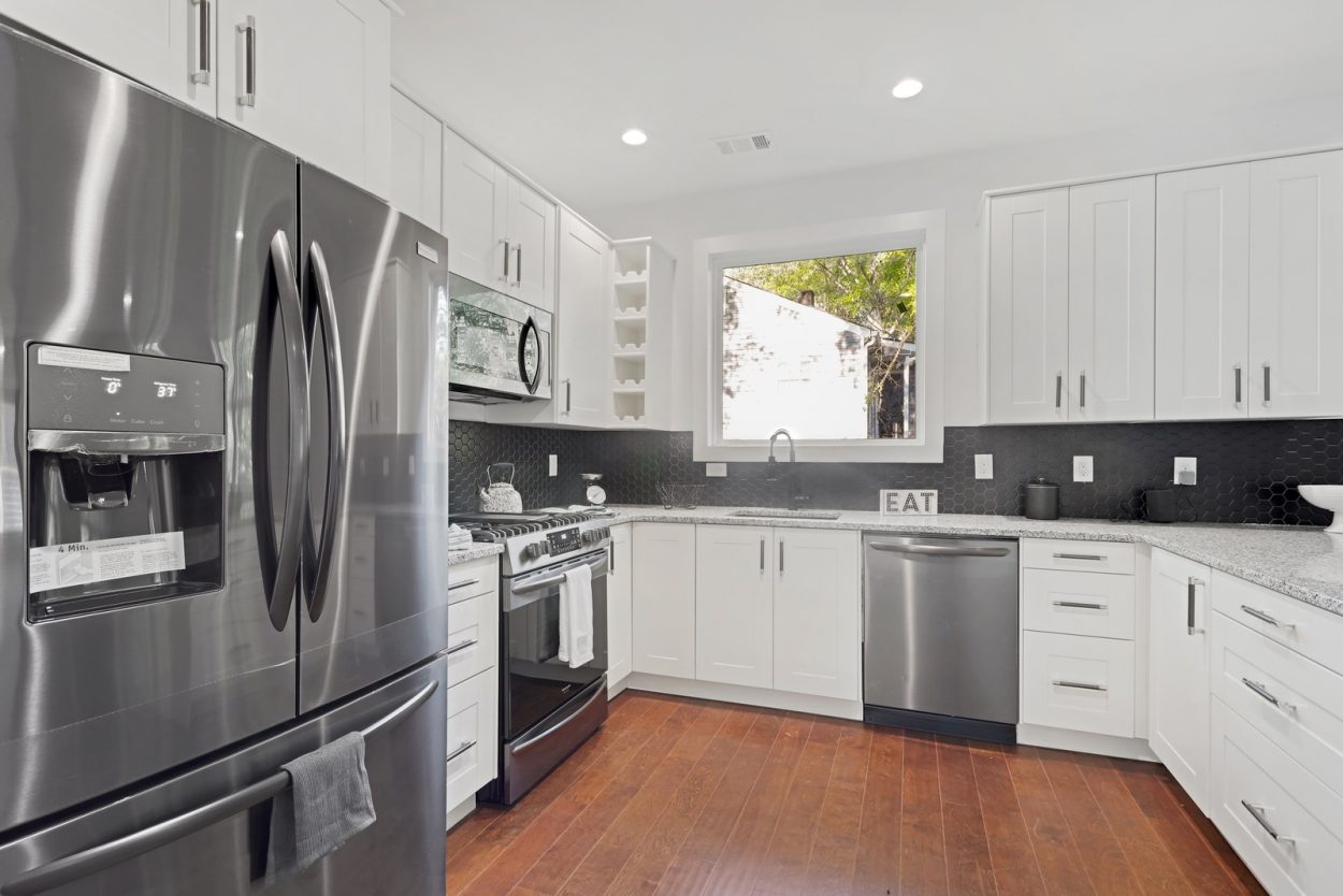 black stainless steel appliances 3573 Orchard Circle Kitchen Peachcrest Belvedere Park Homes For Sale New Construction