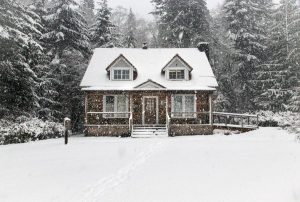 House surrounded by Snow in the winter